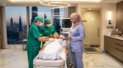UAE medical team preparing a patient for rhinoplasty in a luxury Abu Dhabi clinic.