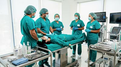 Mexican surgical team preparing in cost-effective modern clinic.