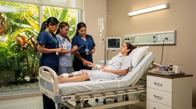 Nursing staff monitors a patient during a post-operative hospital stay in a Mexican medical facility.