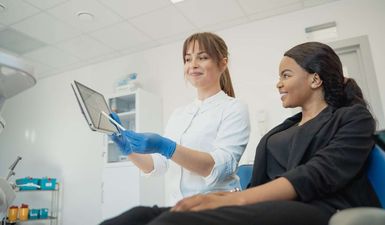 A patient is having a check-up in a dentist's office.