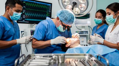 A Mexican surgical team performs a precise mini neck lift in a sterile operating room.