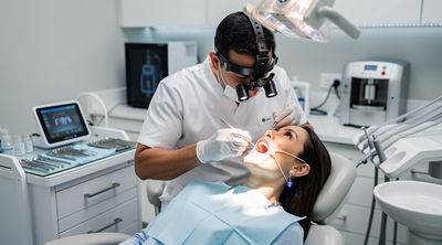A Mexican dentist prepares a patient's tooth for porcelain veneer placement.